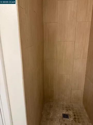 a bathroom with a shower curtain