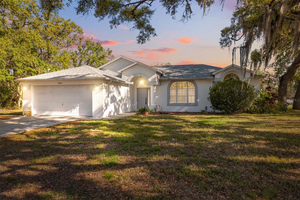 8445 Gallup Road Spring Hill, FL 34608 - Photo 1 of 1 a front view of a house with a yard