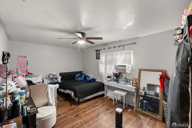 a bedroom with furniture a rug and a window