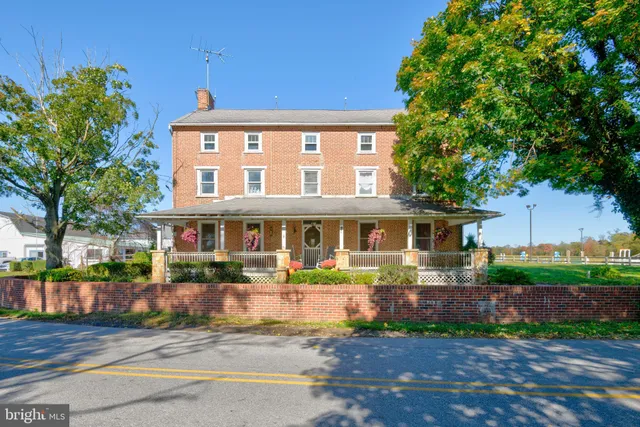 a front view of a house with a large window