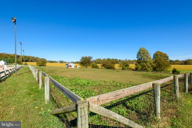 a living room filled with furniture and a wooden floor