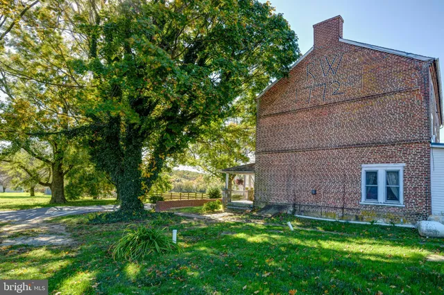 a kitchen with a refrigerator a stove a microwave a sink and cabinets