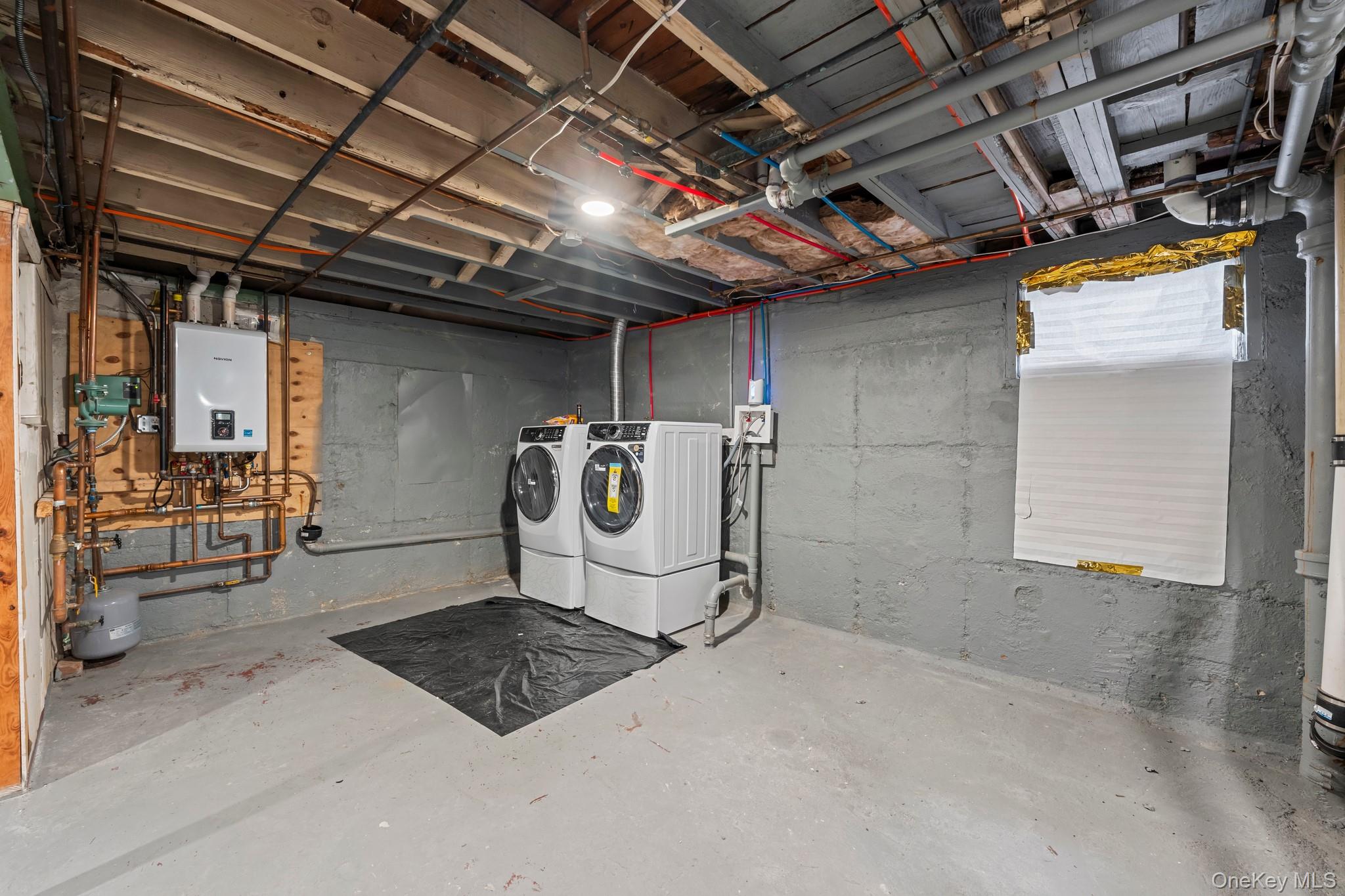 20 Dewitt Street Valley Stream, NY 11580 - Photo 12 of 13 a utility room with dryer and washer