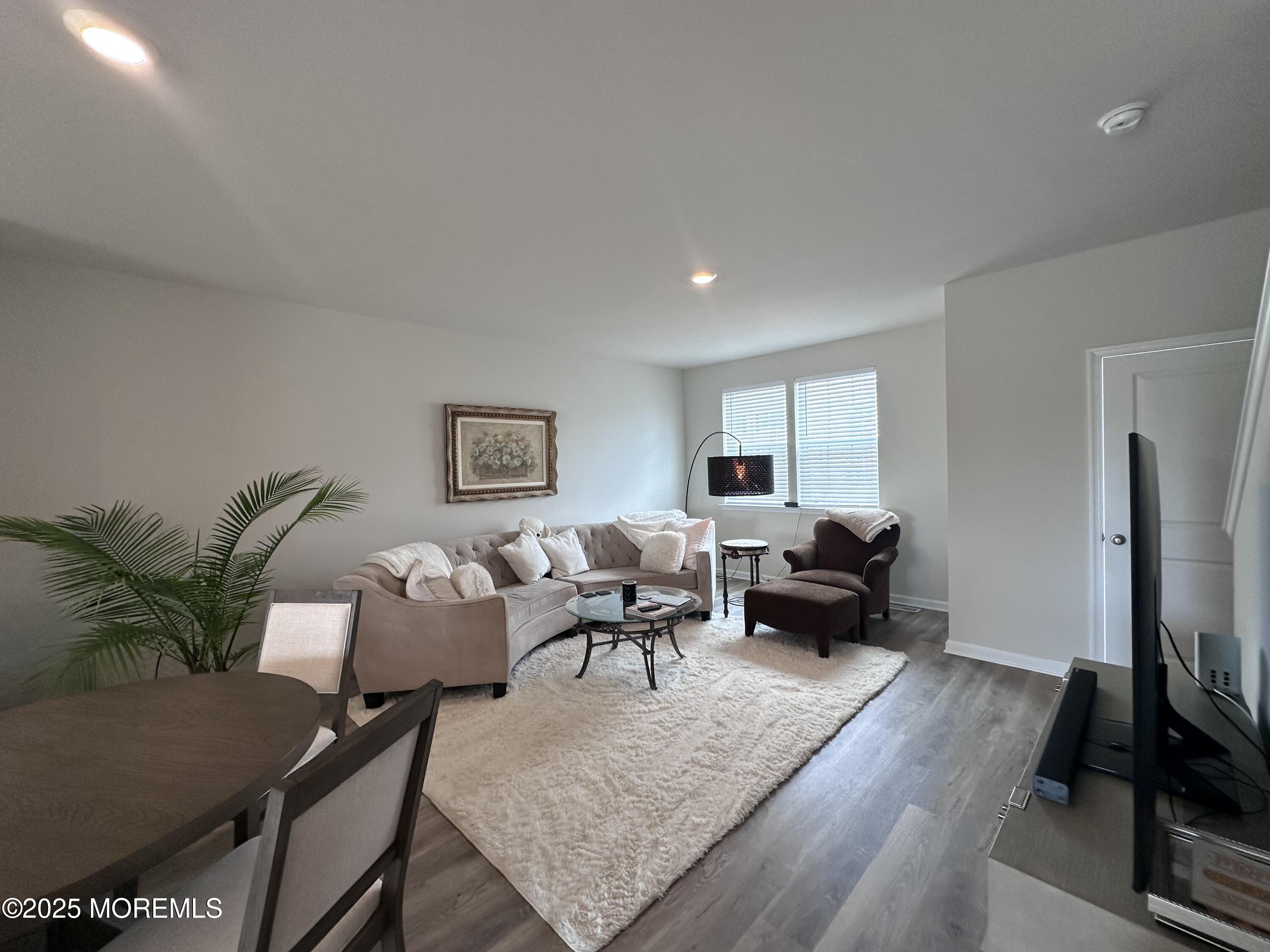 248 Macoun Way Glassboro, NJ 08028 - Photo 12 of 18 a living room with furniture wooden floor and a flat screen tv