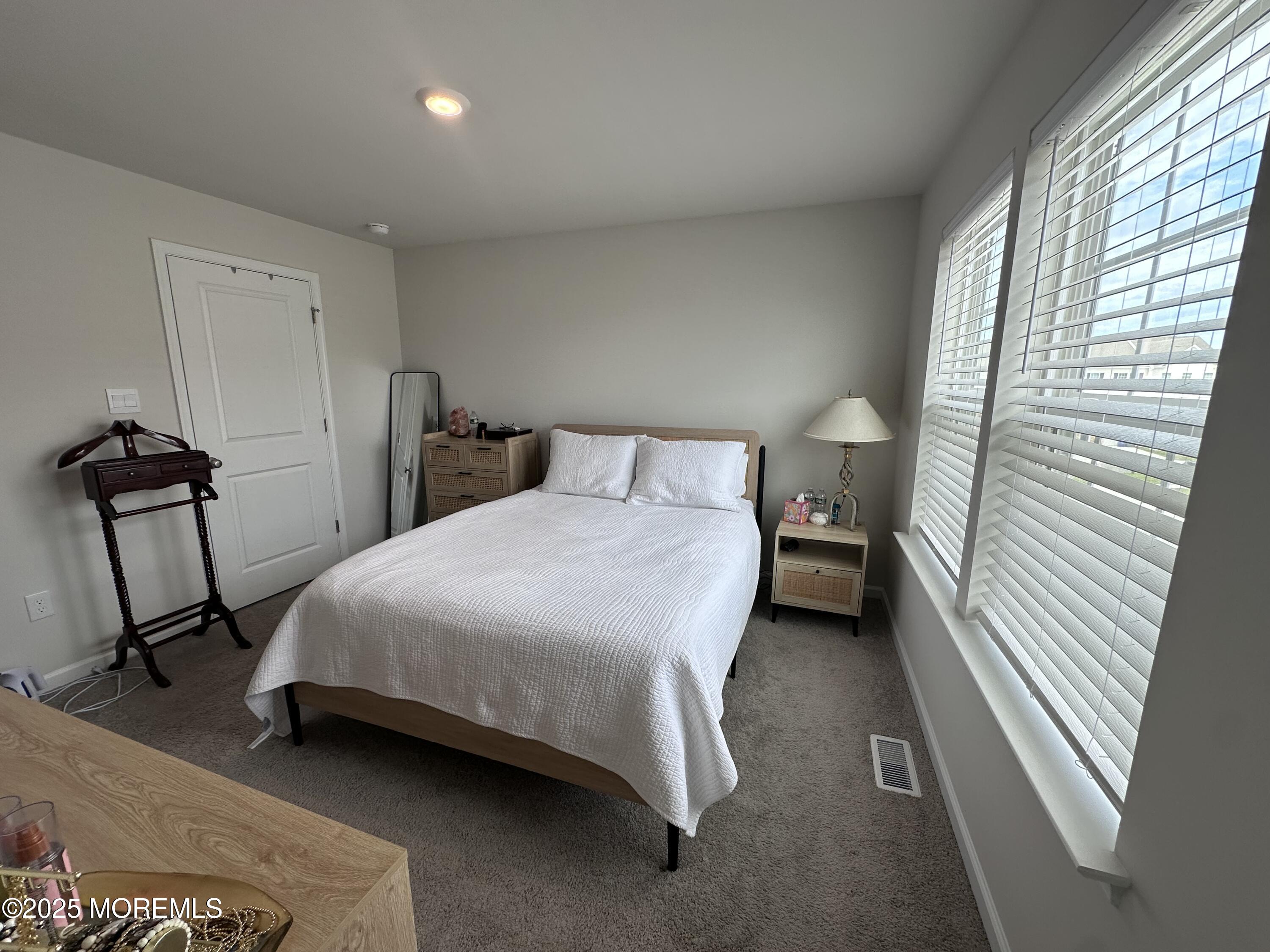 248 Macoun Way Glassboro, NJ 08028 - Photo 13 of 18 a bedroom with a bed a dresser and a window