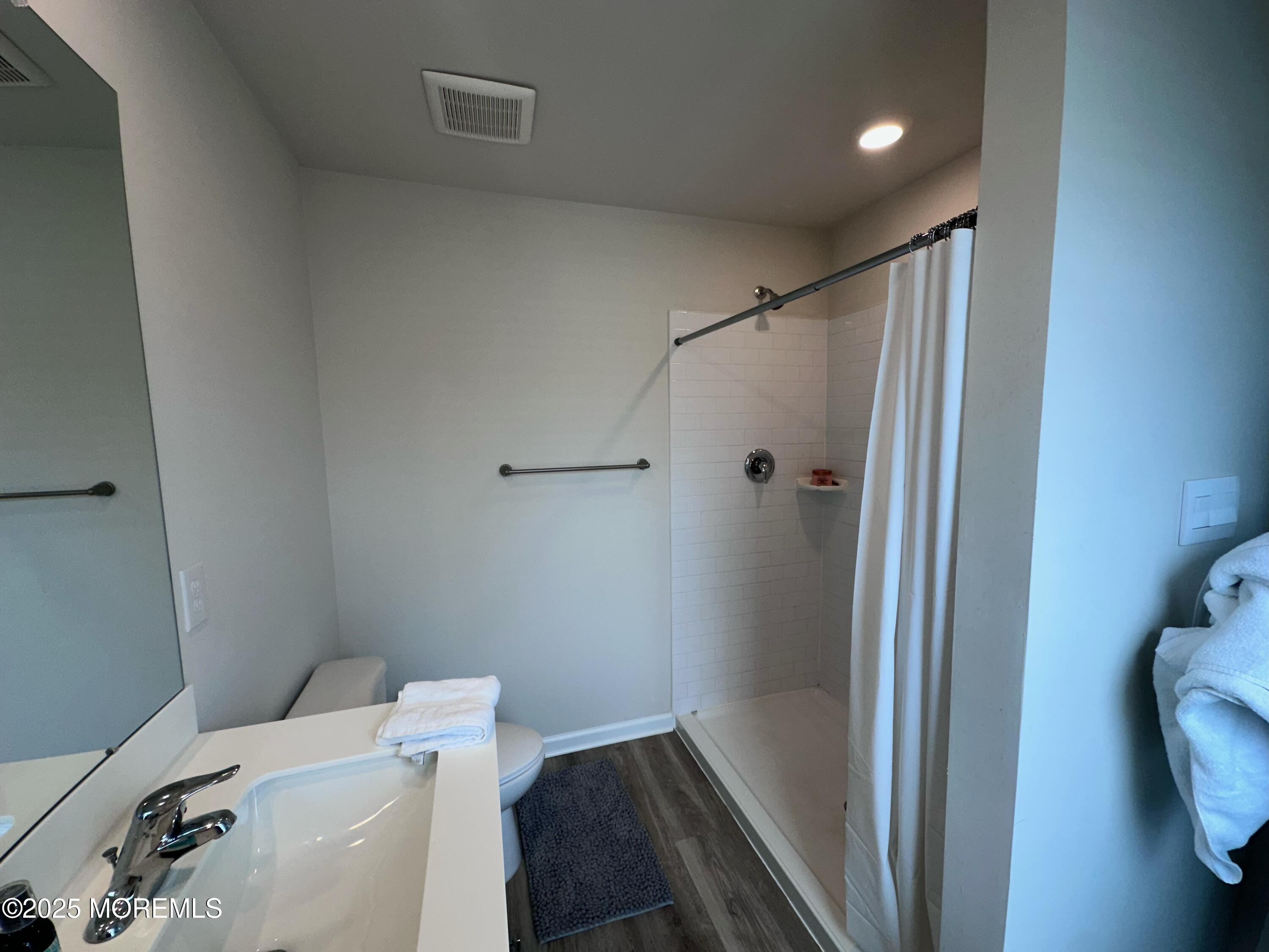 248 Macoun Way Glassboro, NJ 08028 - Photo 17 of 18 a bathroom with a shower toilet and sink