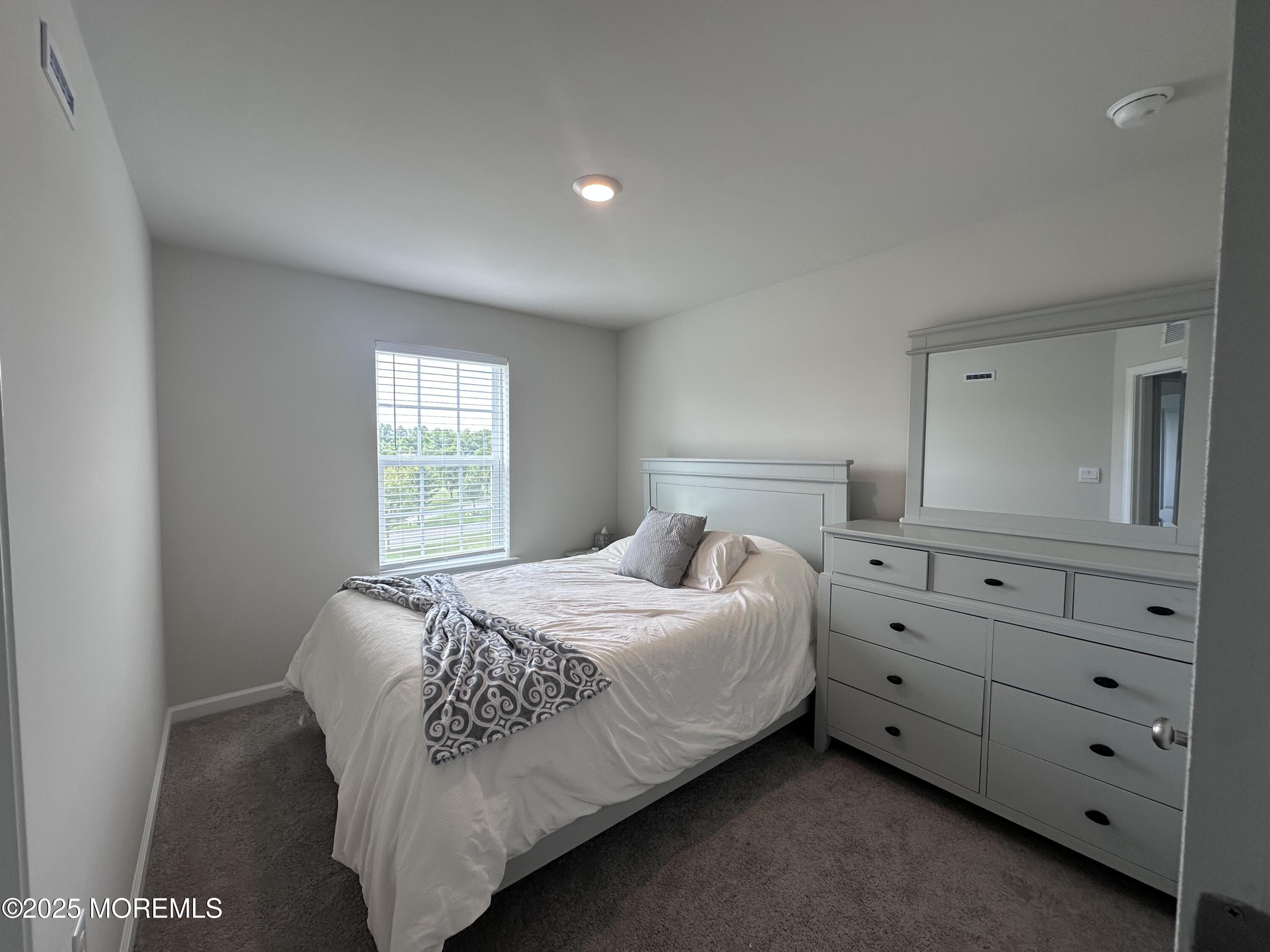 248 Macoun Way Glassboro, NJ 08028 - Photo 10 of 18 a bedroom with a bed and a window