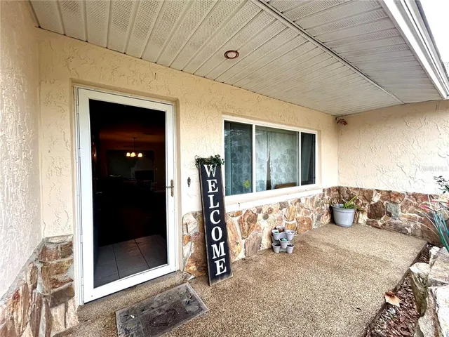 a bedroom with bed and walk in closet