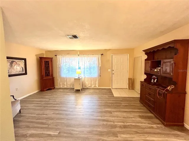 a view of a livingroom with wooden floor