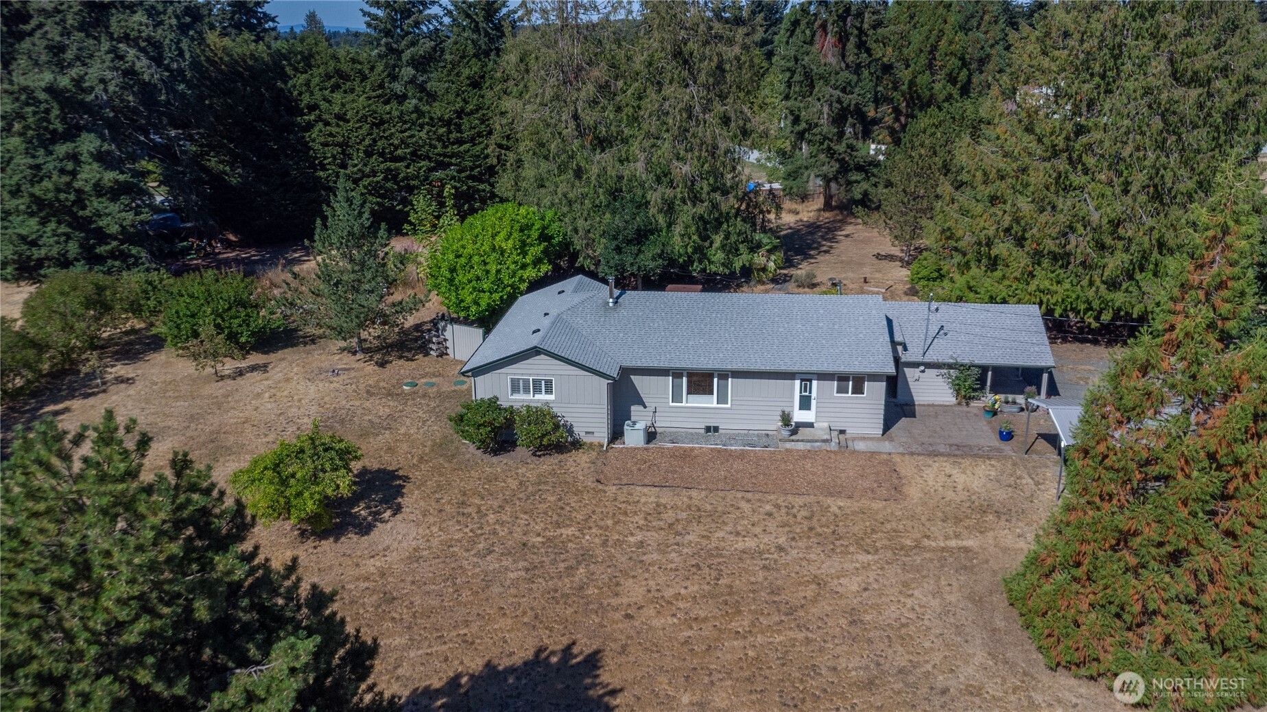245 Gupster Road Sequim, WA 98382 - Photo 2 of 40 front view of a house with a yard