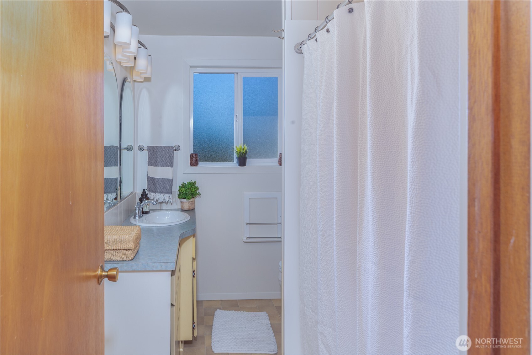 245 Gupster Road Sequim, WA 98382 - Photo 23 of 40 a bathroom with a sink and mirror