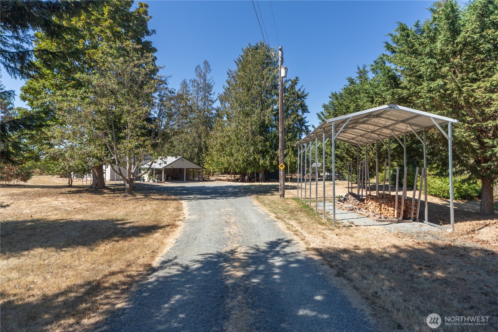 245 Gupster Road Sequim, WA 98382 - Photo 29 of 40 a view of a patio with swimming pool
