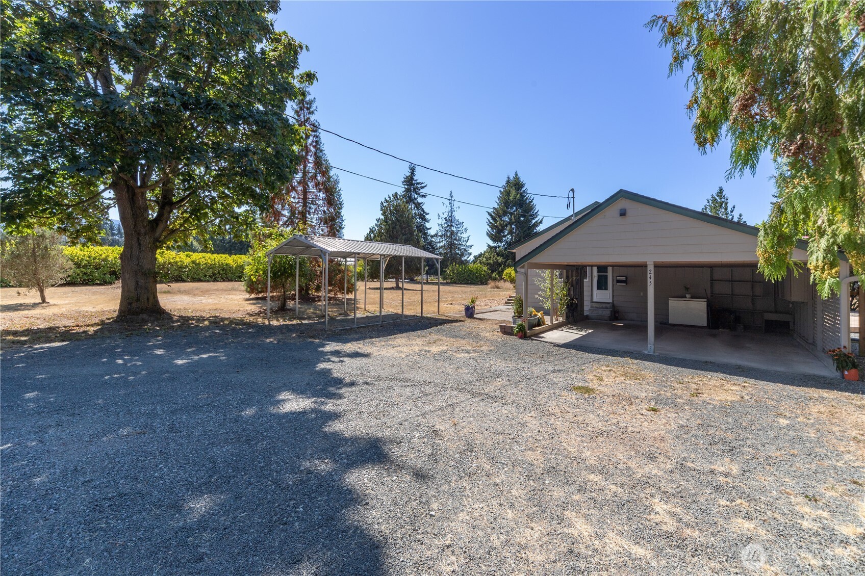 245 Gupster Road Sequim, WA 98382 - Photo 32 of 40 a front view of a house with a yard