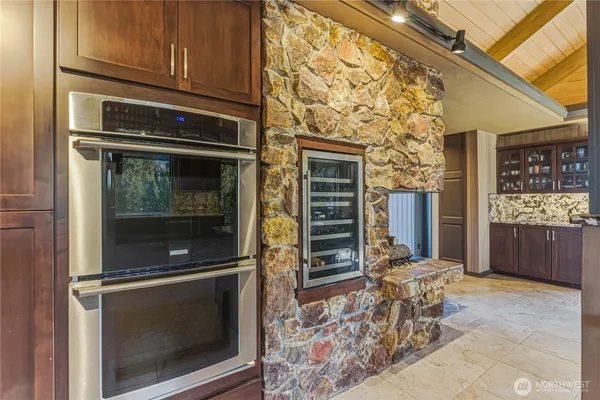 a bedroom with a bed and glass door