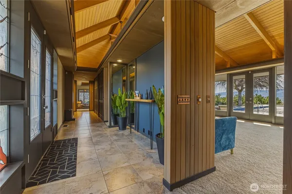 a dining room with furniture and a chandelier