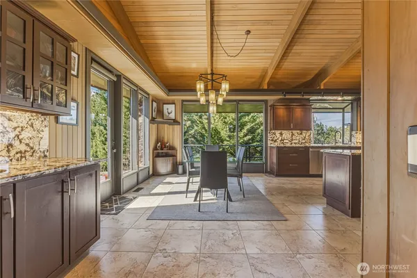 a kitchen with granite countertop stainless steel appliances and wooden cabinets