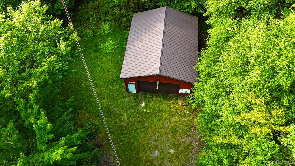 365 Via Appian Way Roscoe, NY 12776 - Photo 22 of 30 a view of a backyard with potted plants