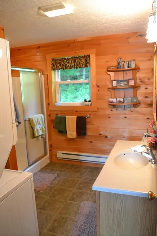 a view of a terrace with outdoor seating and ocean view