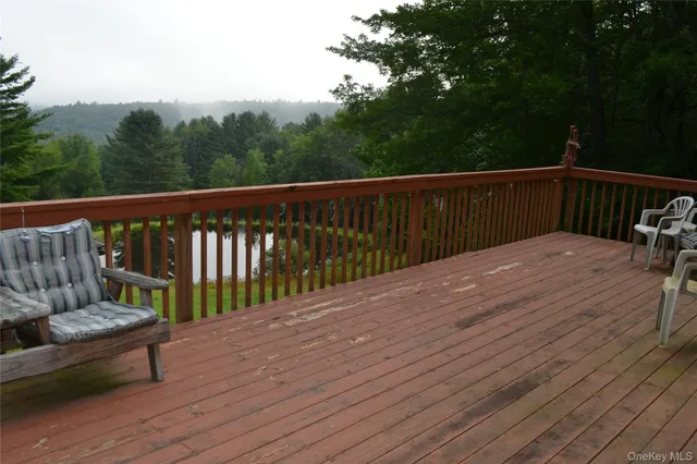 a balcony with wooden floor
