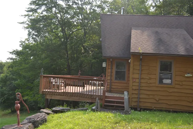 a view of a wooden fence next to a yard