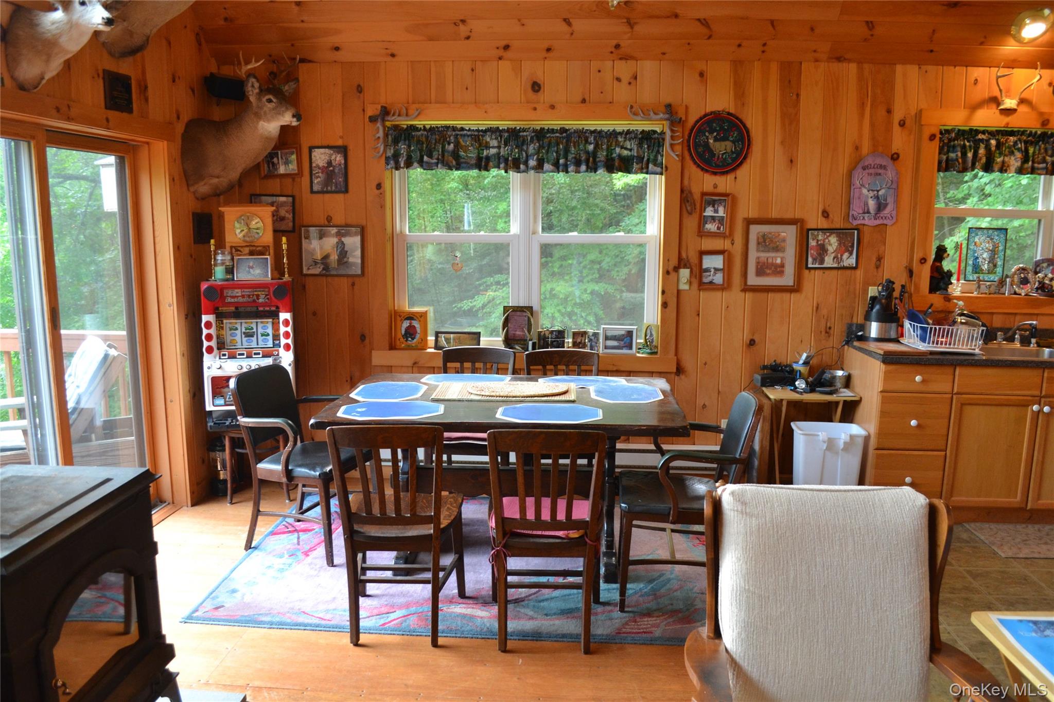 365 Via Appian Way Roscoe, NY 12776 - Photo 28 of 30 a dining room with furniture and a floor to ceiling window