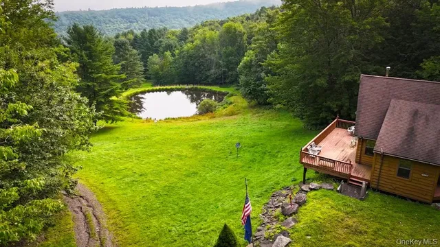 an aerial view of a house with a garden