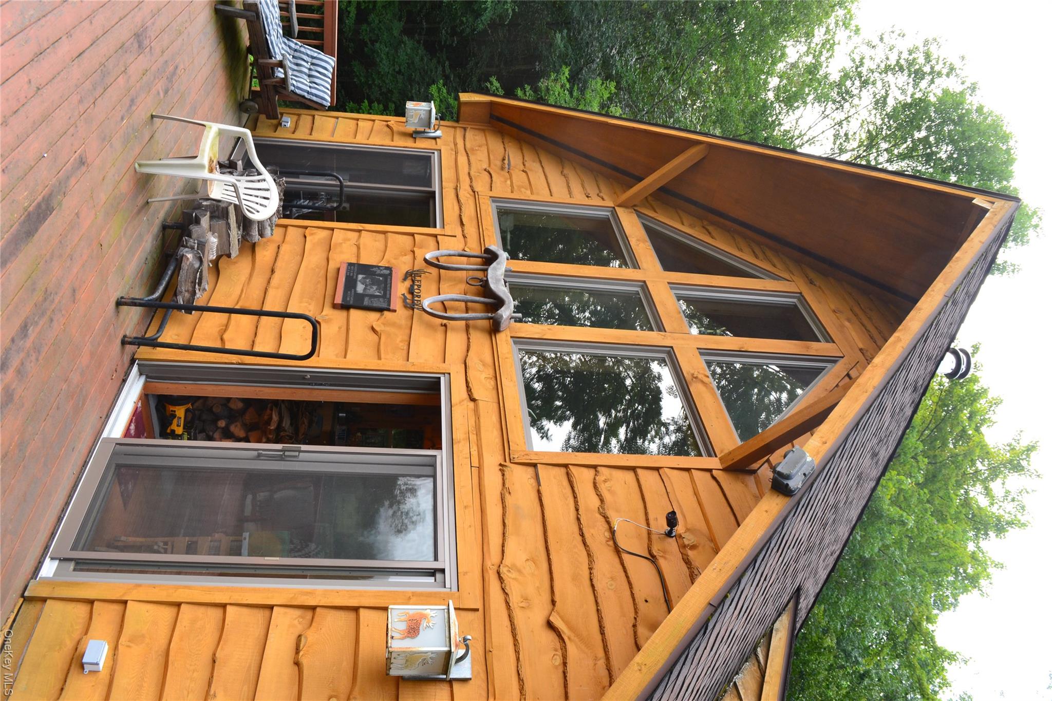 365 Via Appian Way Roscoe, NY 12776 - Photo 3 of 30 Rear view of house with roof with shingles and a wooden deck