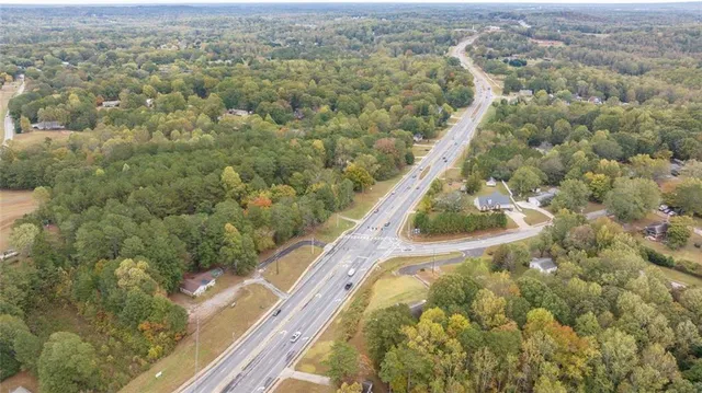 an aerial view of a house with a swimming pool