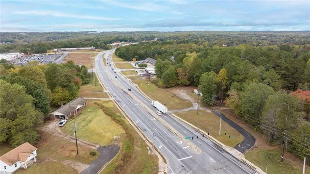 a view of a park with large trees