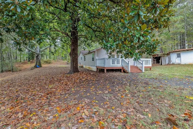 a kitchen with a refrigerator a sink and cabinets
