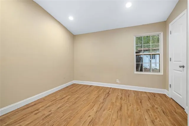 a bathroom with a glass shower door