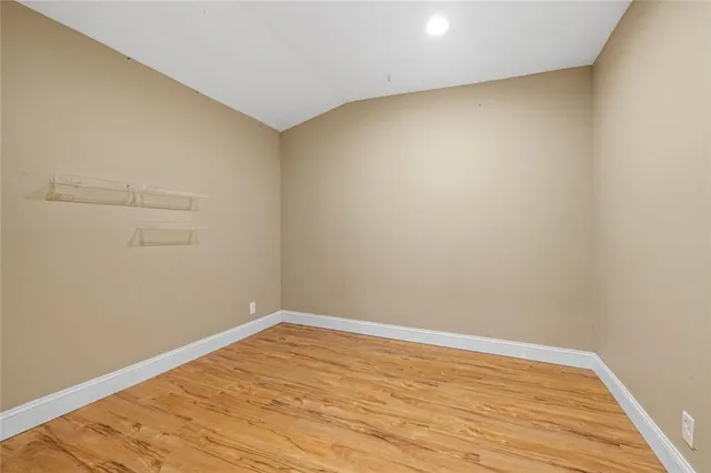 a view of dirt yard with a trees