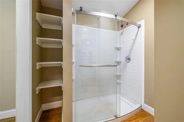 a view of a field with trees in the background