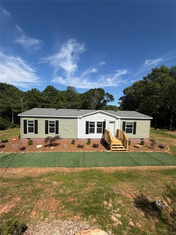 2606 Whipporwill Road Royston, GA 30662 - Photo 1 of 30 a view of a yard in front of a house with large trees