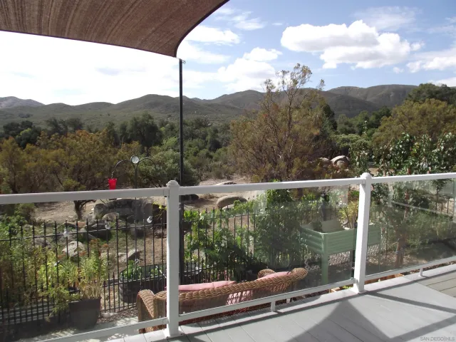 a view of a balcony with an outdoor space