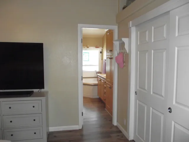 a room that has a bed and a chair in it