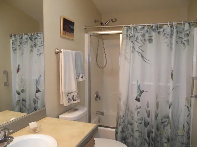 a bathroom with a bathtub and shower