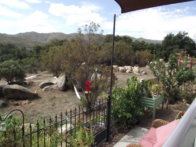 a view of a wooden floor and lake view