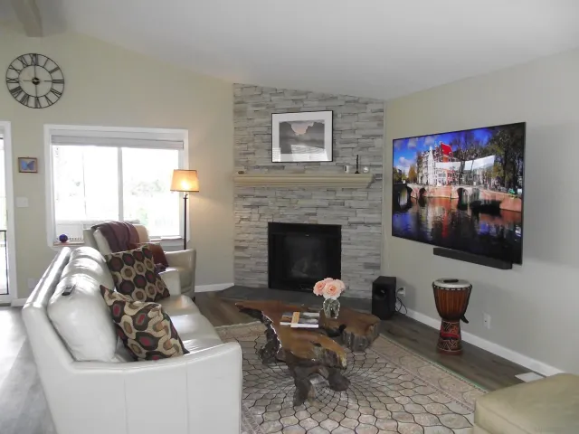 a kitchen with sink refrigerator dining table and chairs