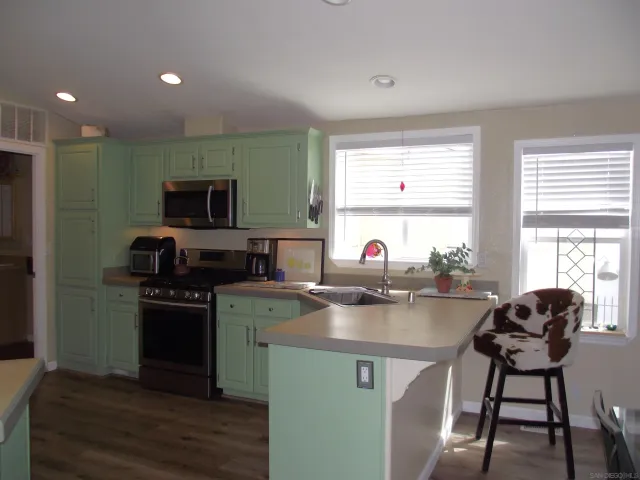 a kitchen with a stove and a microwave