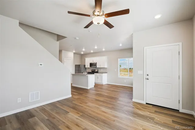 a view of kitchen with wooden floor