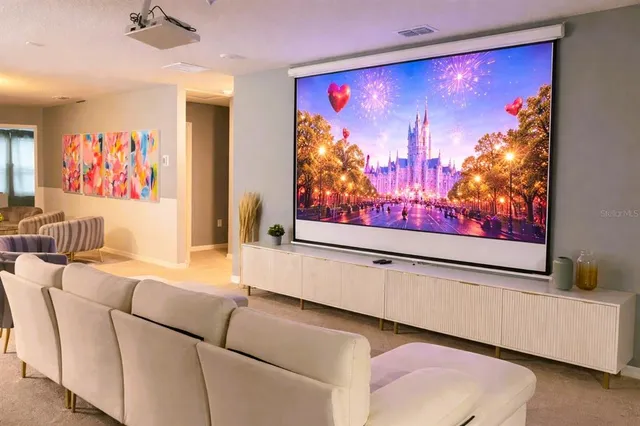 a living room with furniture and a mirror