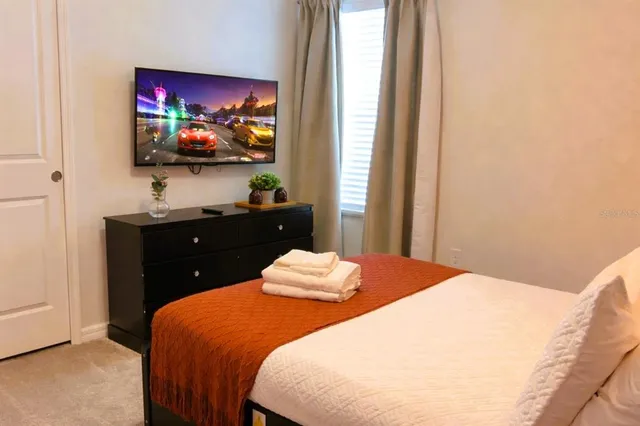 a bathroom with a granite countertop sink mirror and a shower