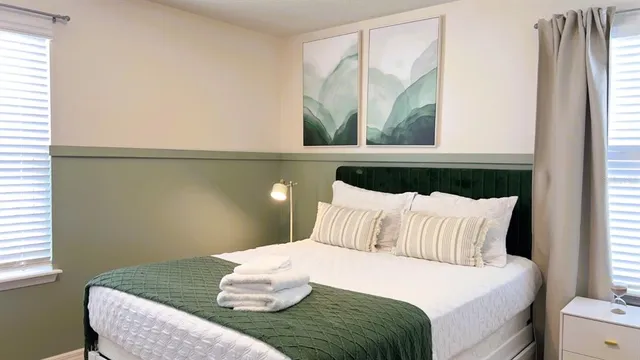 a bathroom with a granite countertop sink a toilet and a shower