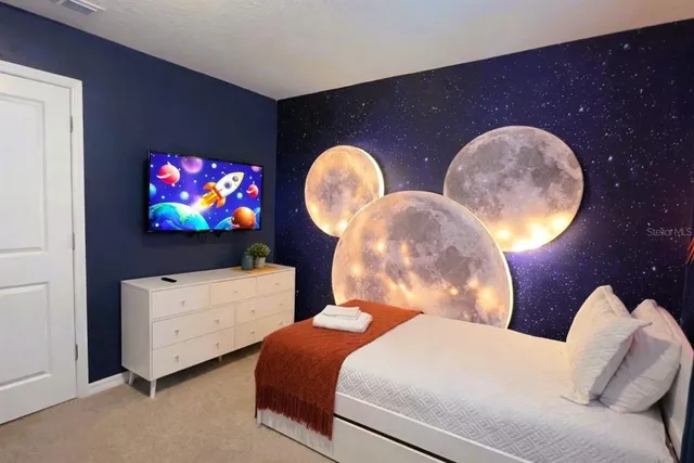 an aerial view of a residential houses with outdoor space