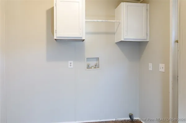 a view of cabinets and a window