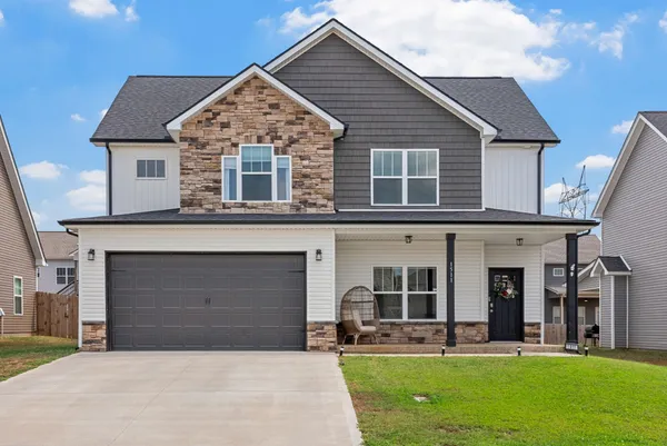 front view of a house with a yard