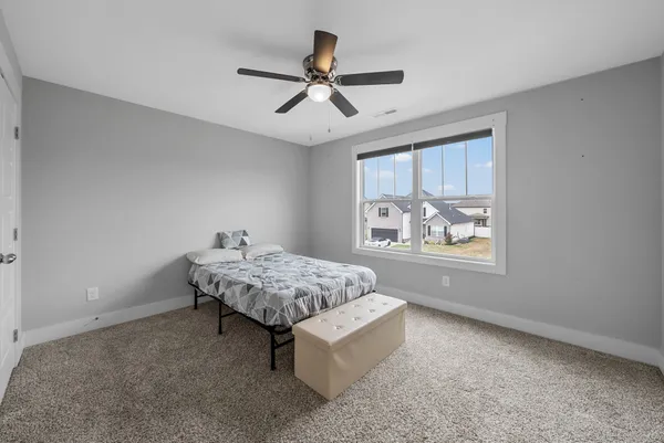 a living room with hard wood floors and a window