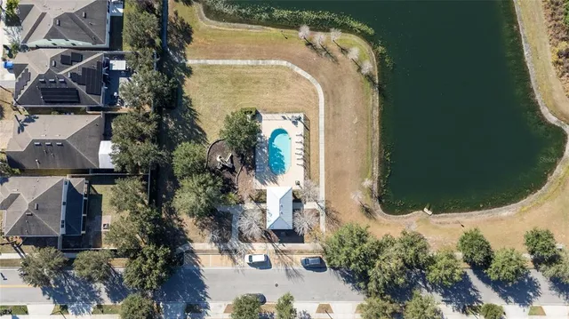 an aerial view of a house with a swimming pool