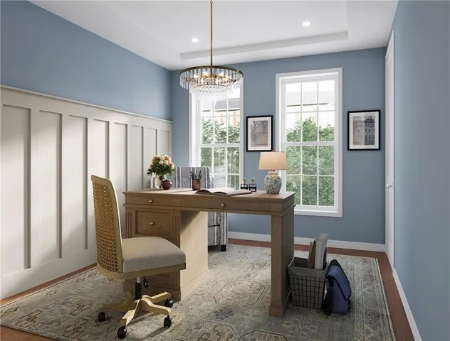 a living room with furniture a window and a chandelier